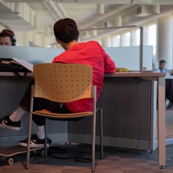 back of student studying